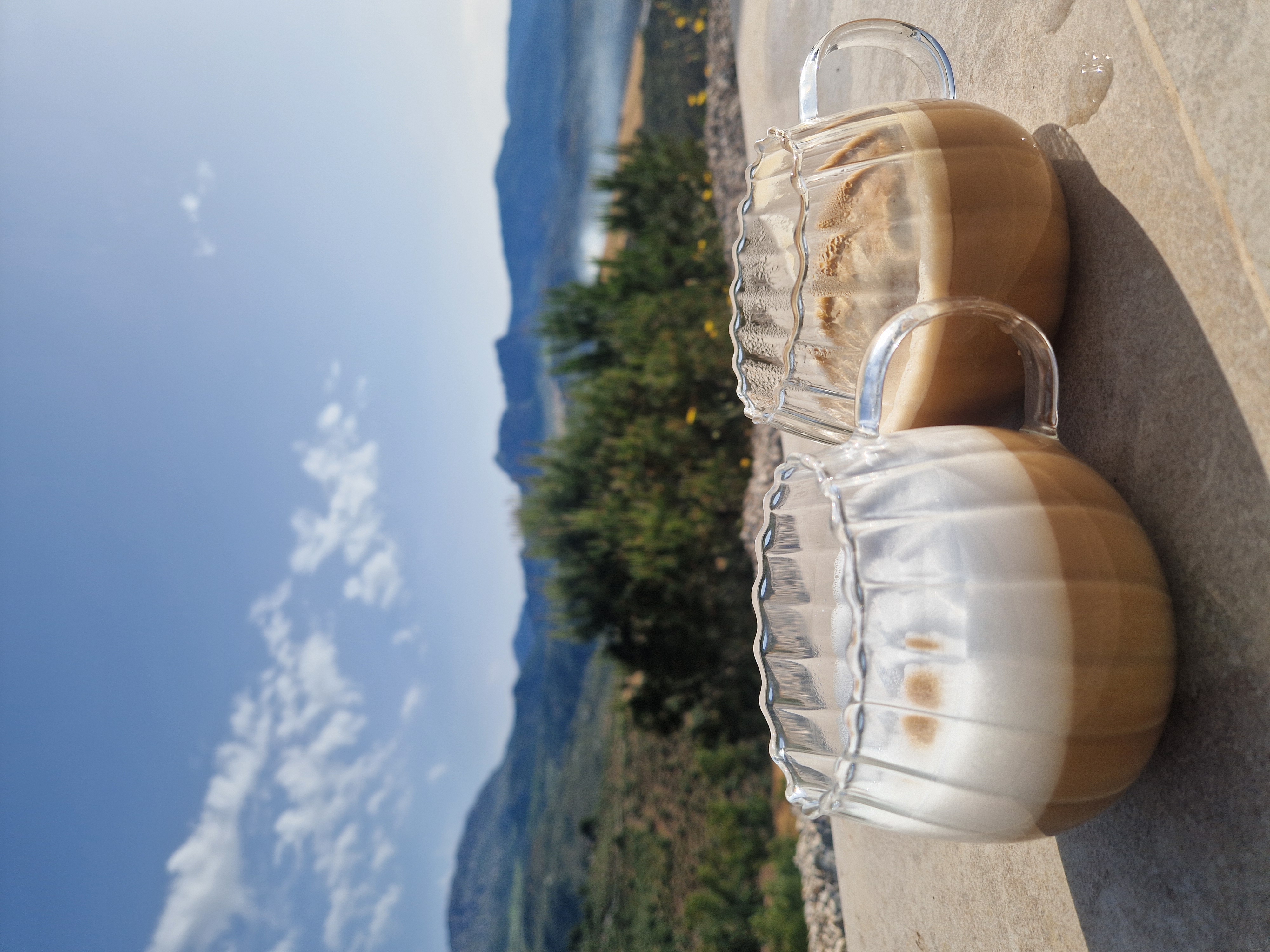 Two cups of coffee on a terrace overlooking the mountains of Andalusia in southern Spain, capturing a slow living moment in nature
