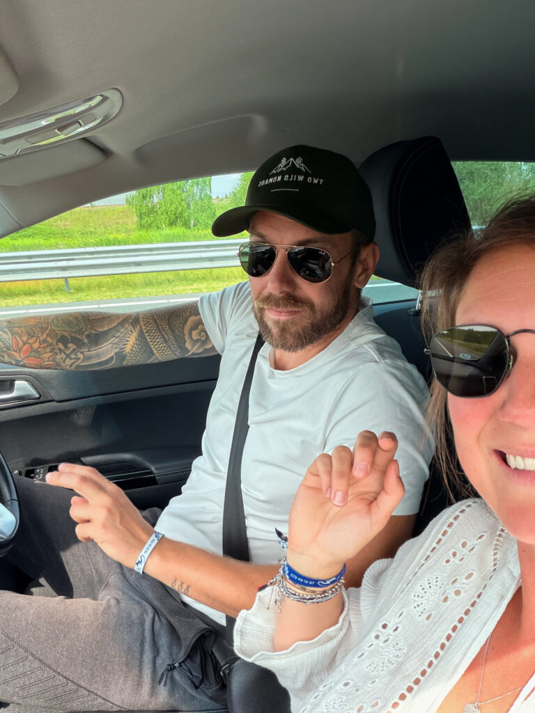 Couple driving through Europe during their final road trip preparations before starting full-time world travel.