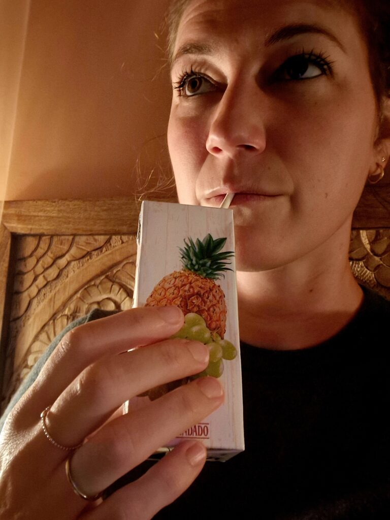 Woman with type 1 diabetes holding a carbohydrate snack while traveling to manage blood sugar levels